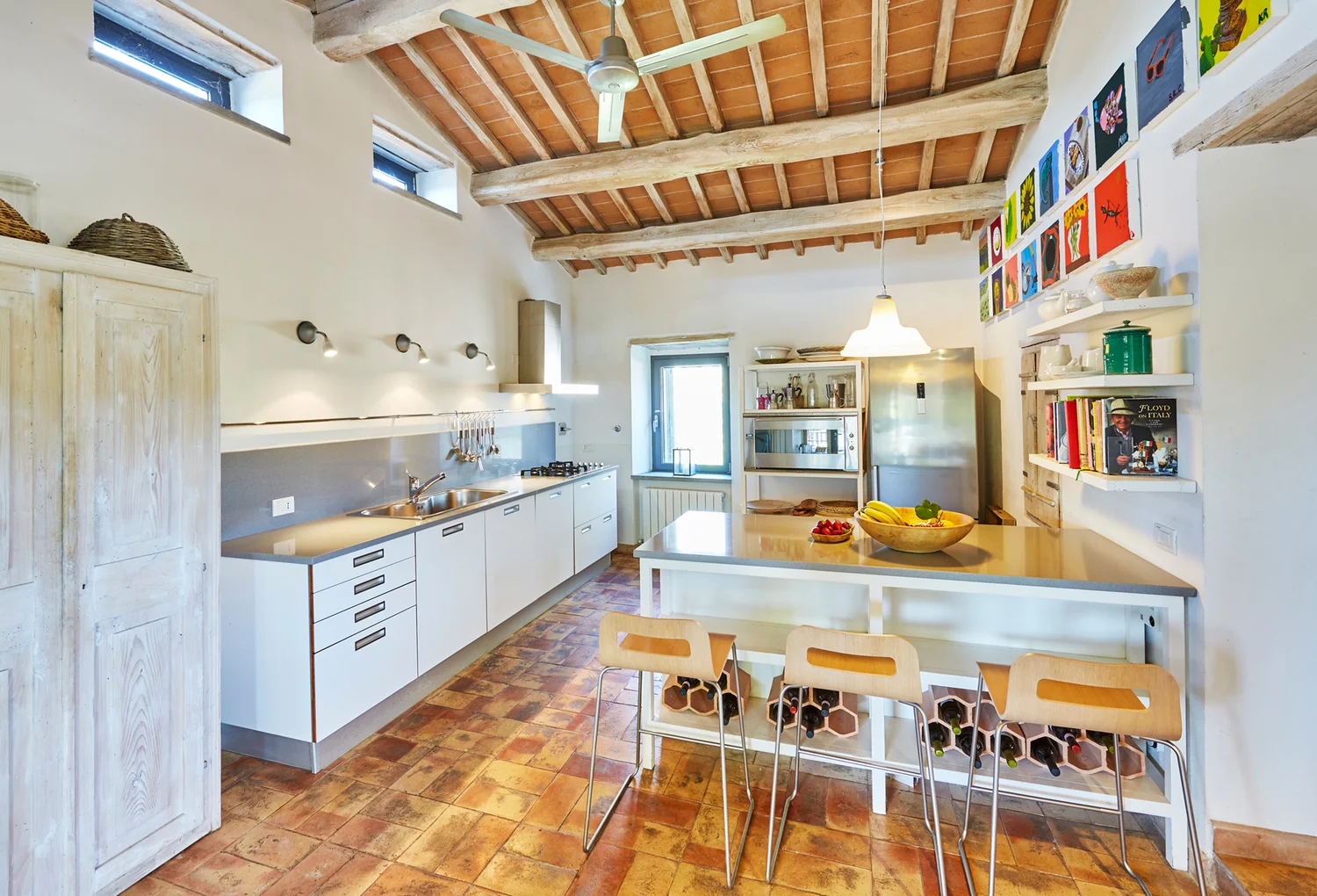 Bright modern kitchen with breakfast bar and beamed ceiling